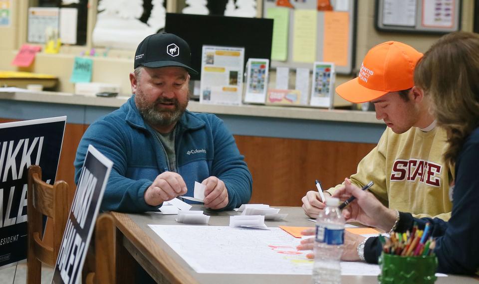 Brandon Lee, precinct-17 caucus chairman (left), counts the ballots in the GOP Iowa Caucus at Ames Middle School on Monday, Jan. 15, 2024, in Ames, Iowa. (Nirmalendu Majumdar/Ames Tribune-USA Today Network)