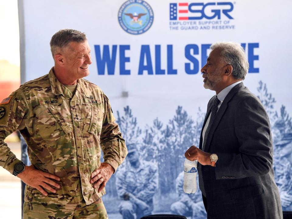 Maj. Gen. Jeff Holmes, Adjunct General for the Tennessee National Guard, chats with ORNL director Thomas Zacharia before an awards presentation. Oak Ridge National Laboratory was presented with the 2022 Secretary of Defense Employer Support Freedom Award by the Tennessee Employer Support for Guard and Reserve at the McGhee Tyson Air National Guard Base on Monday, Sept. 19, 2022.