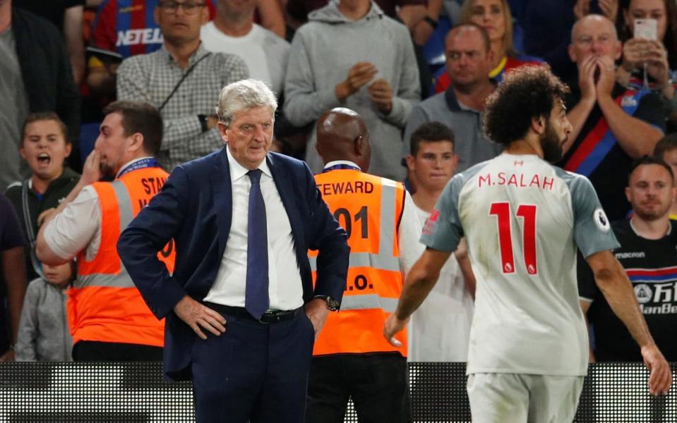 Roy Hodgson was furious with the referee's decision to give a penalty to Liverpool for a foul on Mo Salah - REUTERS