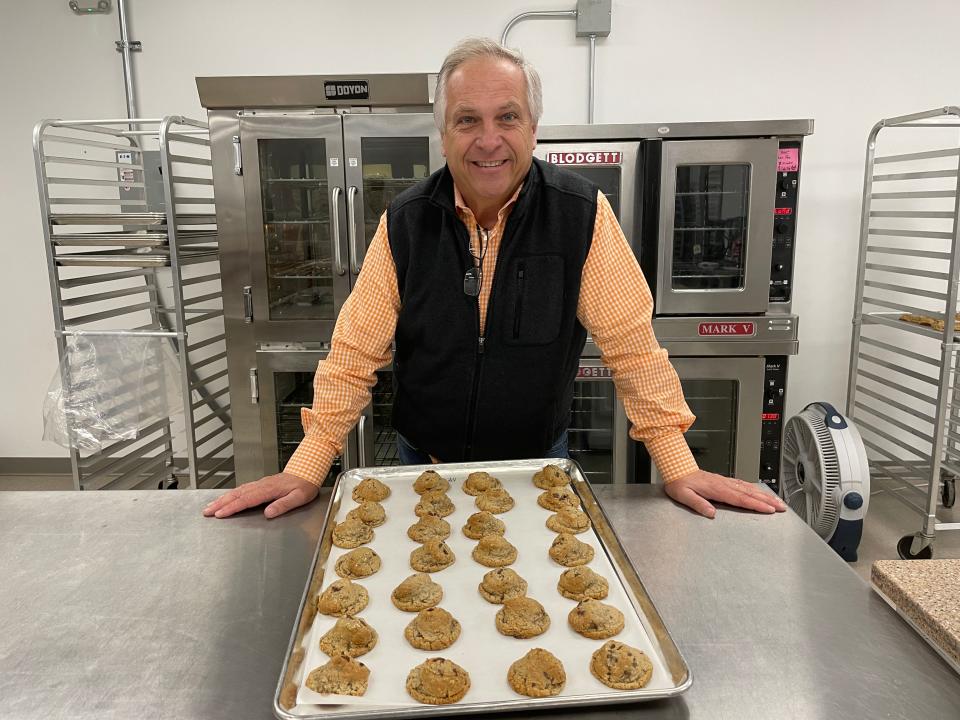 Co-founder Mike Maddux shows off a fresh batch of Rocky Top cookies at Moonshine Mountain Cookie Company, 10205 Kingston Pike, Wednesday, Jan. 5, 2022.