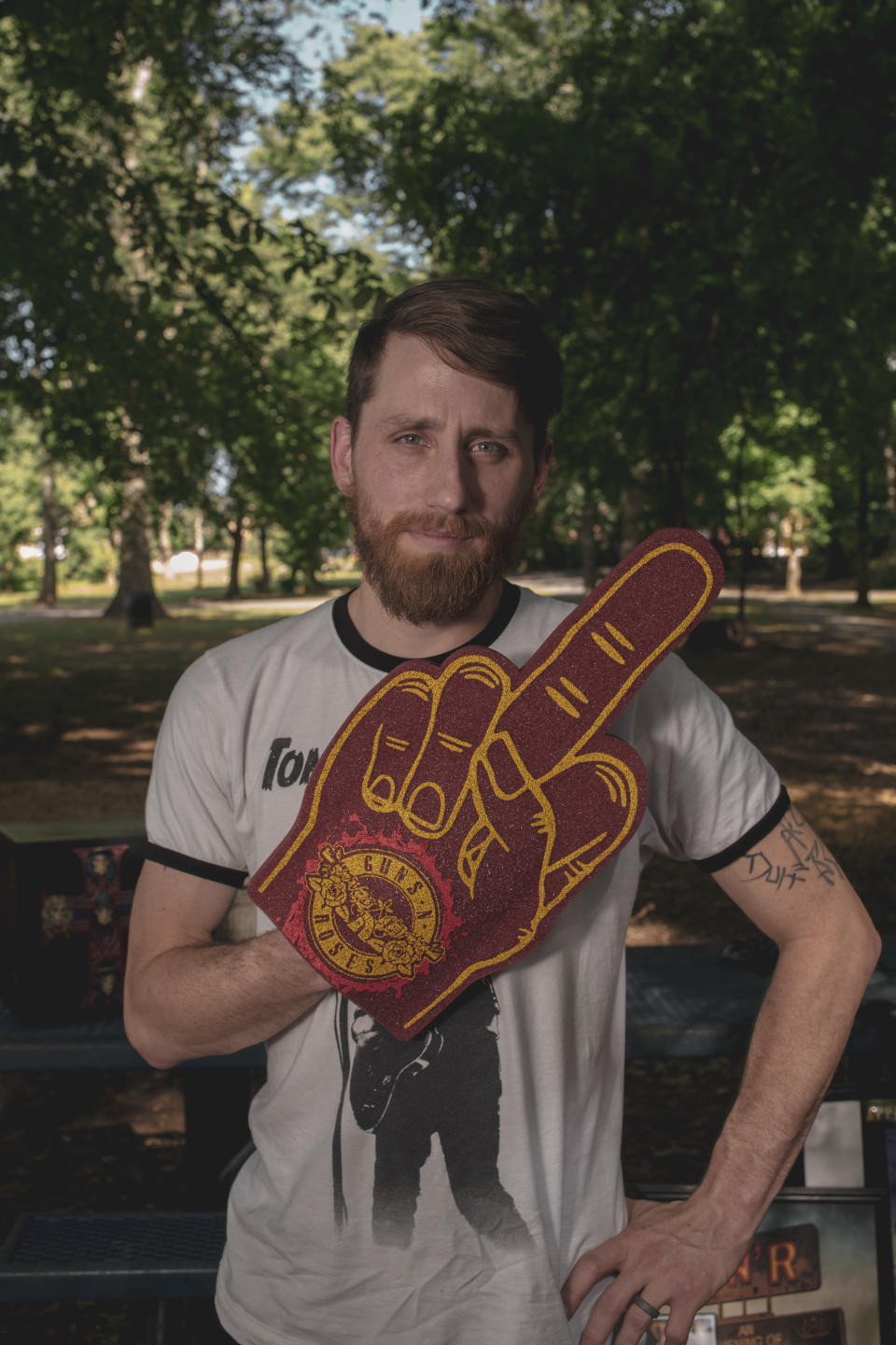 May 31, 2022 - TUPELO, MS: Rick Dunsford stands for a portrait at a park near his home. Dunsford is a hardcore Guns-N-Roses fan and memorabilia collector that got caught up in allegations of leaking unreleased music by the band. 

Photo by Andrea Morales