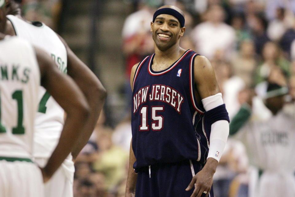 FILE - New Jersey Nets forward Vince Carter smiles during the final minute of a 102-93 win over the Boston Celtics in an NBA basketball game in Boston, Wednesday April 20, 2005. The Brooklyn Nets are retiring the No. 15 jersey of Carter, the high-flying guard who will be enshrined this year in the Naismith Memorial Basketball Hall of Fame, the team announced Wednesday, May 15, 2024. (AP Photo/Charles Krupa, File)