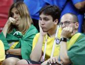 <p>Brazil’s supporters are dejected after missing out on a place in the semi finals </p>