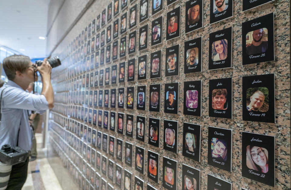 FILE—A photojournalist takes pictures of the exhibits on "The Faces of Fentanyl" at DEA headquarters before a press event at DEA headquarters, Arlington, Va., in this file photo from Sept. 27, 2022. Heading into key elections, there have been assertions that the drug might be handed out like Halloween candy, something the U.S. Drug Enforcement Agency's head has said isn't true. And some candidates for elected office frame the crisis as mostly a border-control issue, though experts say the key to reining in the crisis is reducing demand for the drugs.(AP Photo/Gemunu Amarasinghe, File)