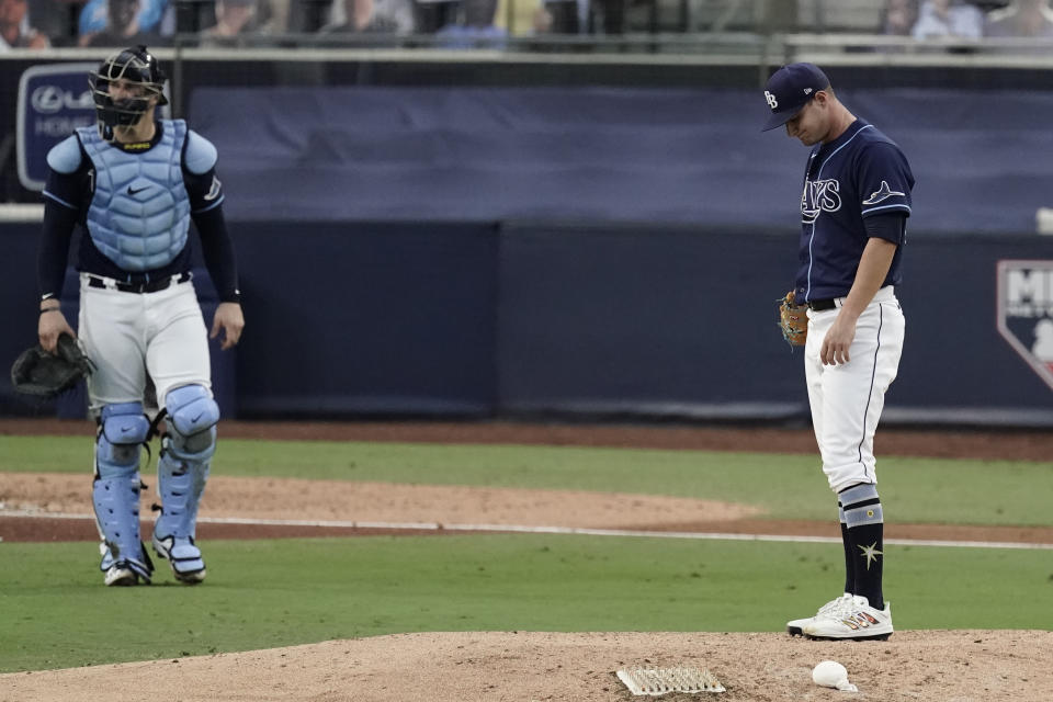 Tampa Bay Rays pitcher Shane McClanahan, right, waits to be relieved during the seventh inning in Game 6 of a baseball American League Championship Series against the Houston Astros, Friday, Oct. 16, 2020, in San Diego. (AP Photo/Jae C. Hong)