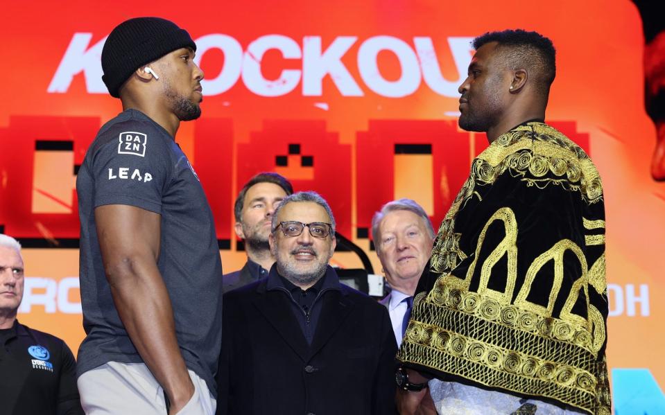 Anthony Joshua (left) Francis Ngannou