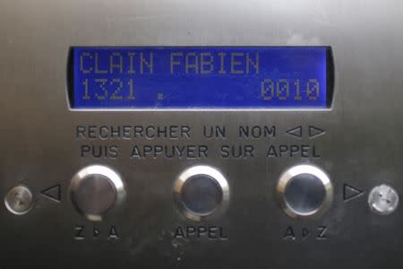 A name reading "Clain Fabien" is seen on the interphone at the entrance of an apartment building where Fabien Clain, identified as the voice in an audio recording claiming responsibility for the Paris attacks, grew up in Alencon, France, November 25, 2015. REUTERS/Stephane Mahe