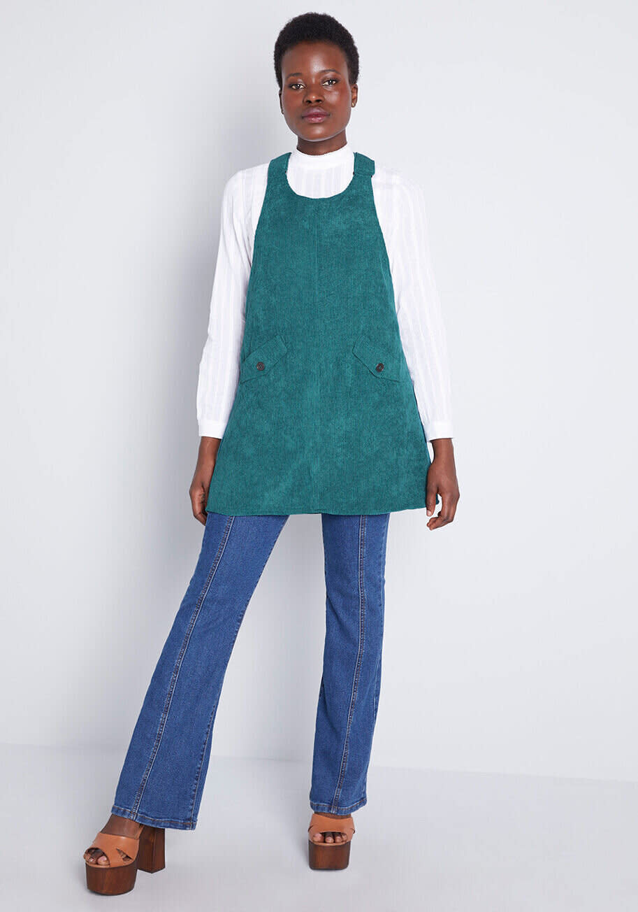 1970s silhouettes are back in a big way. From wide-leg trousers and jeans (yep, flare jeans are back) to oversized belt buckles, it's clear that the looser, flowier looks and textures of the '70s are back for fall. (Pictured: <strong><a href="https://fave.co/2MUrLtM">Modcloth's Sociable Scholar Corduroy Jumper</a></strong>)