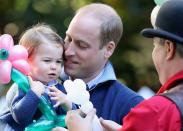 <p>Prince William and Princess Charlotte share a sweet daddy-daughter moment but Charlotte only has eyes for the balloon artist and the next balloon toy he’s making. [Photo: Getty/Chris Jackson] </p>