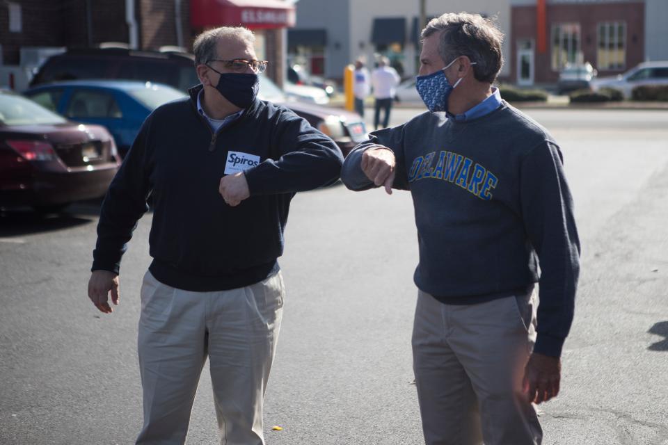 Democratic candidate for state Senate in District 7 Spiros Mantzavinos, left, greets Gov. John Carney at the polling location at the Elsmere Fire Hall on Tuesday, Nov. 3, 2020.