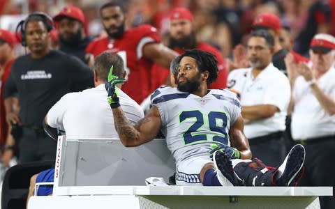 Seattle Seahawks safety Earl Thomas (29) flips off his teams bench as he leaves the field on a cart after suffering an injury in the fourth quarter against the Arizona Cardinals at State Farm Stadium - Credit:  USA TODAY Sports