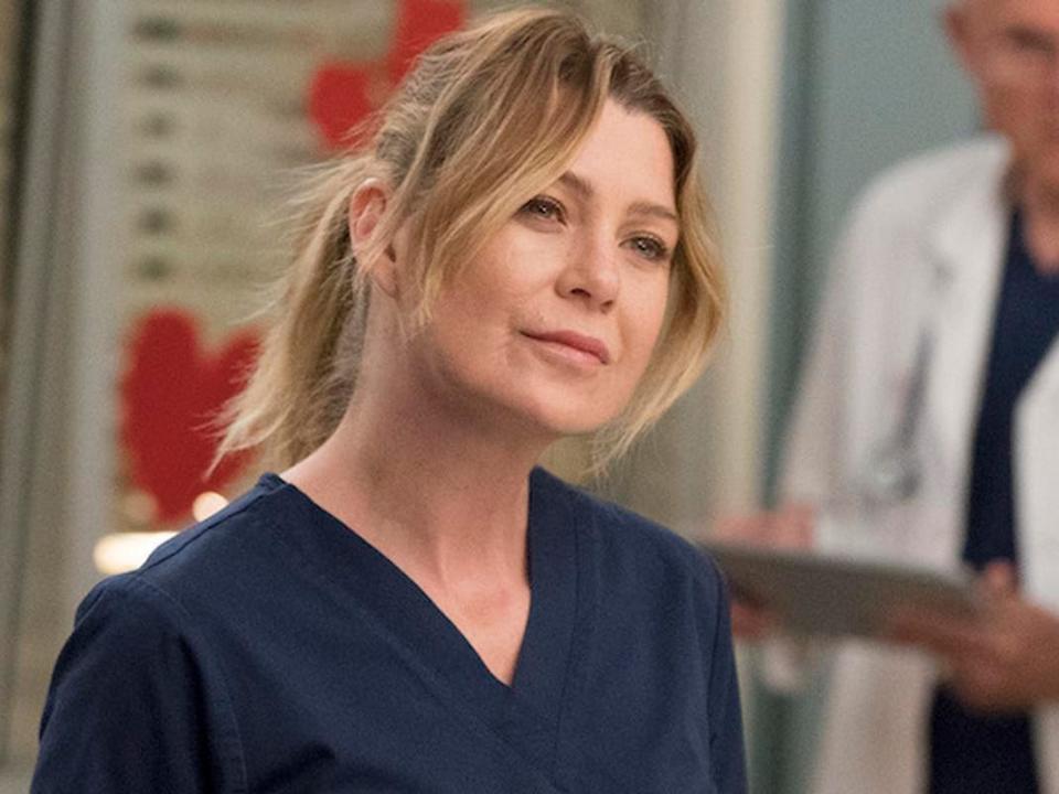 Ellen Pompeo in navy blue scrubs