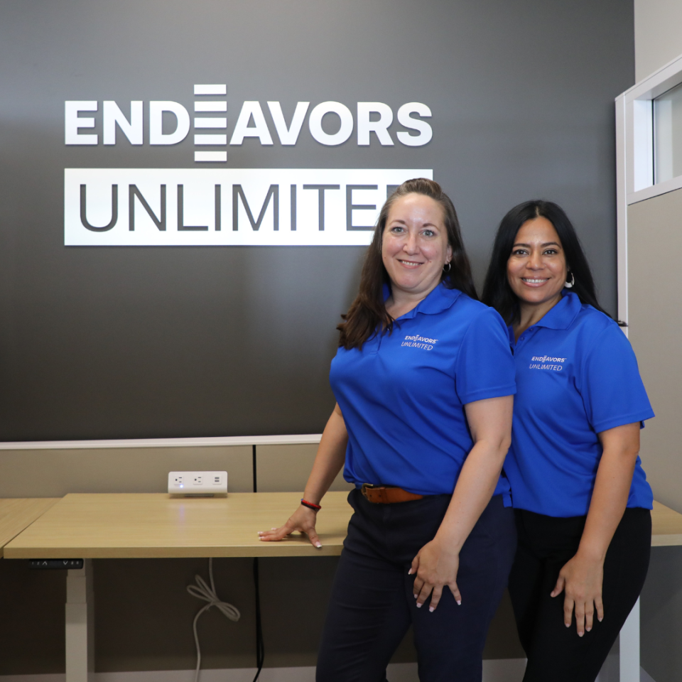 Endeavors Unlimited team members stand in their offices at the Workforce Inclusion Network.