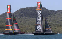 Ineos Team UK, right, leads Italy's Luna Rossa during the Prada Cup challengers series on Auckland's Waitemate Harbour, New Zealand, Friday, Jan. 15, 2021. The winner of the five week long Challenger Series goes on to challenge defenders Team New Zealand for the America's Cup from March 6 to 15. (Brett Phibbs/NZ Herald via AP)