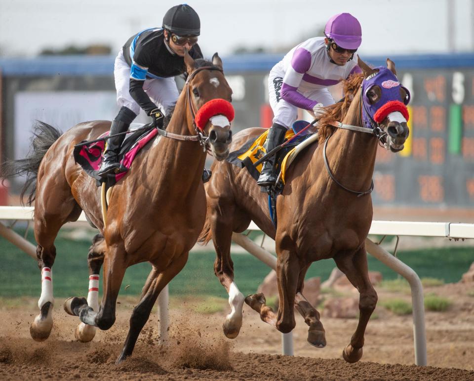 At far right, Sunland Park Derby winner Slow Down Andy takes the lead in the first half of the race as Straight Up G tries to keep up during the 2022 Sunland Derby at Sunland Park racetrack and  Casino in New Mexico on March 27, 2022. 