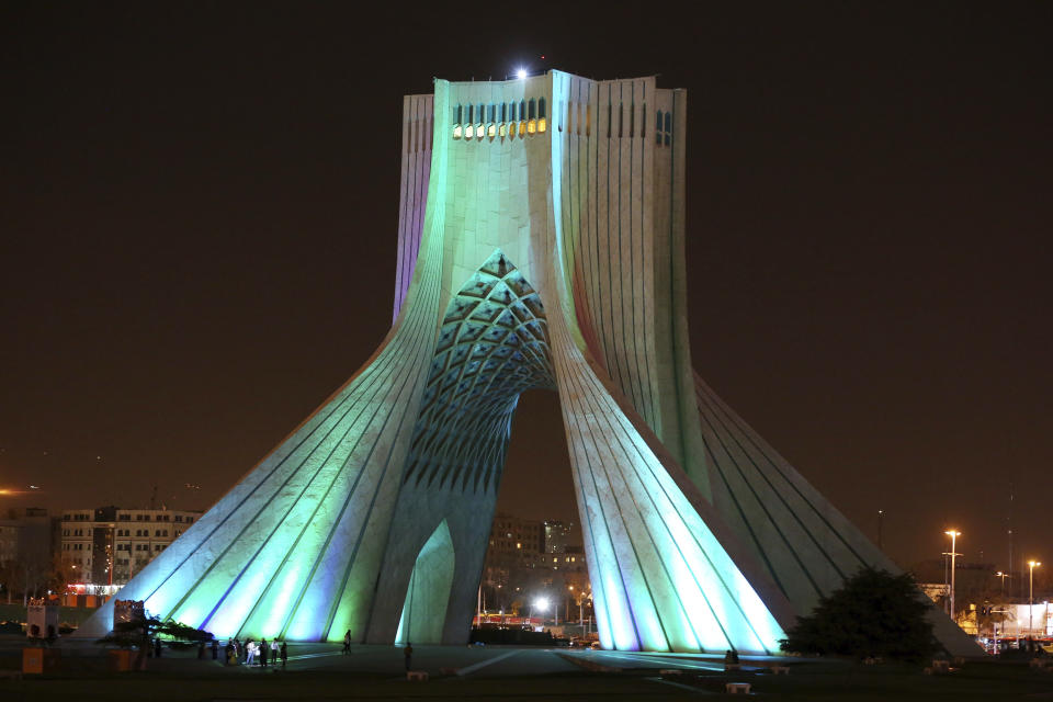FILE— In this March 29, 2014 file photo, the Azadi (Freedom) tower is illuminated in the Iranian capital, Tehran. Iran's ancient and rich cultural landscape has become a potential U.S. military target as Washington and Tehran stumble toward a possible open conflict. (AP Photo/Ebrahim Noroozi, File)