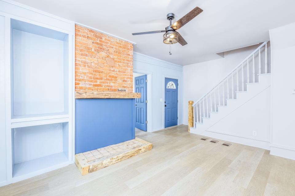 The living room of the home at 1228 Putnam Ave. showcases a white and blue theme.