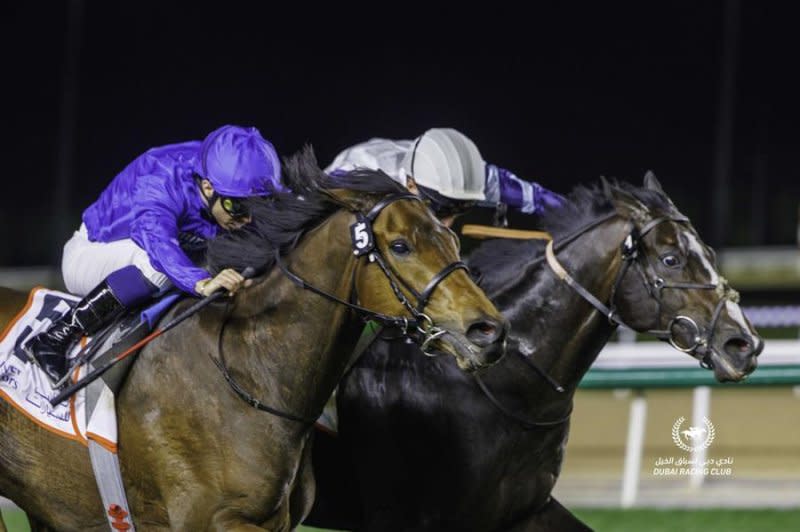 Warren Point wins the Group 3 Dubai Millennium Stakes at Meydan Racecourse Friday. Photo courtesy of Dubai Racing Club