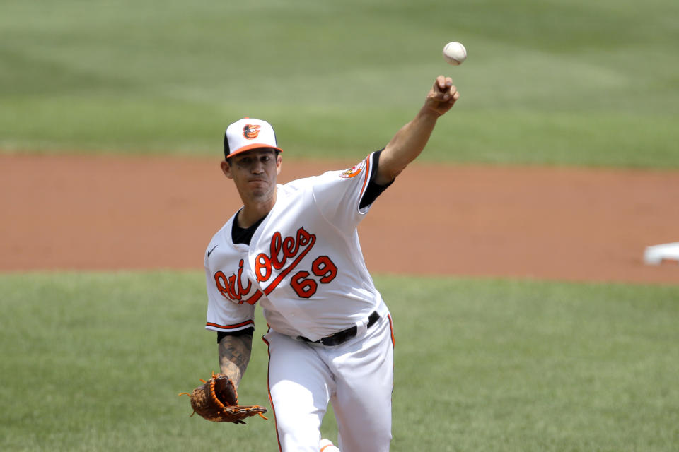 Baltimore Orioles starting pitcher Tommy Milone throws a pitch to the Tampa Bay Rays during the first inning of a baseball game, Sun, Aug. 2, 2020, in Baltimore. (AP Photo/Julio Cortez)