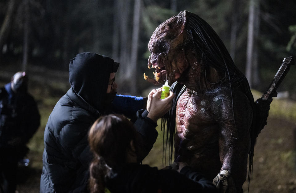 Dane DiLiegro as the Predator gets a touch-up while in his Predator suit. - Credit: David Bukach