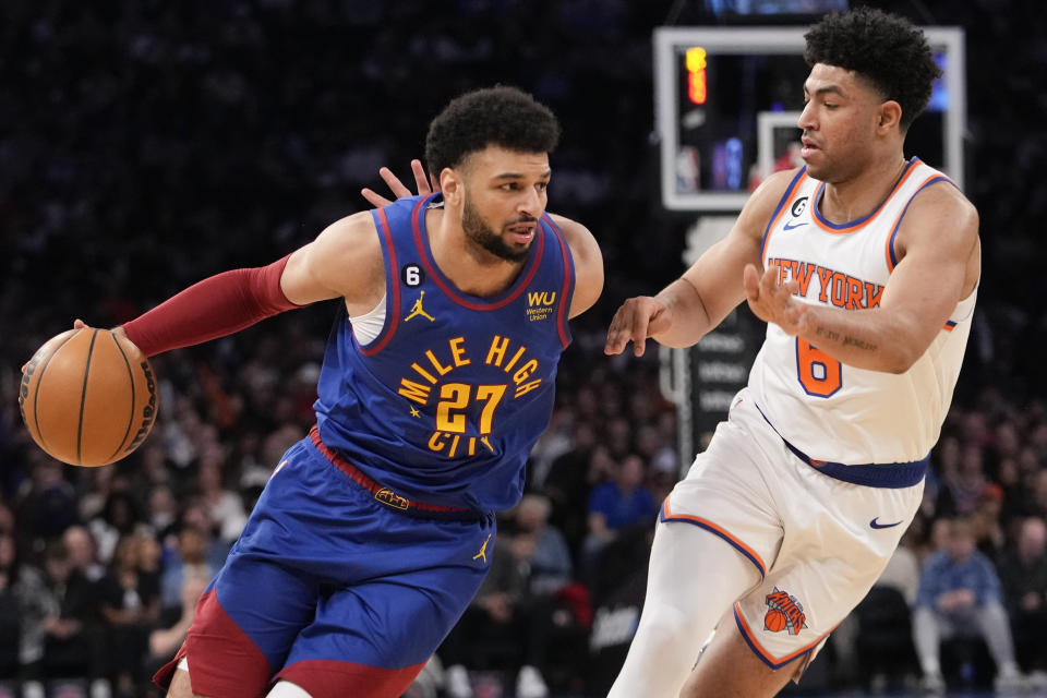 Denver Nuggets guard Jamal Murray (27) drives against New York Knicks guard Quentin Grimes (6) during the first half of an NBA basketball game, Saturday, March 18, 2023, at Madison Square Garden in New York. (AP Photo/Mary Altaffer)