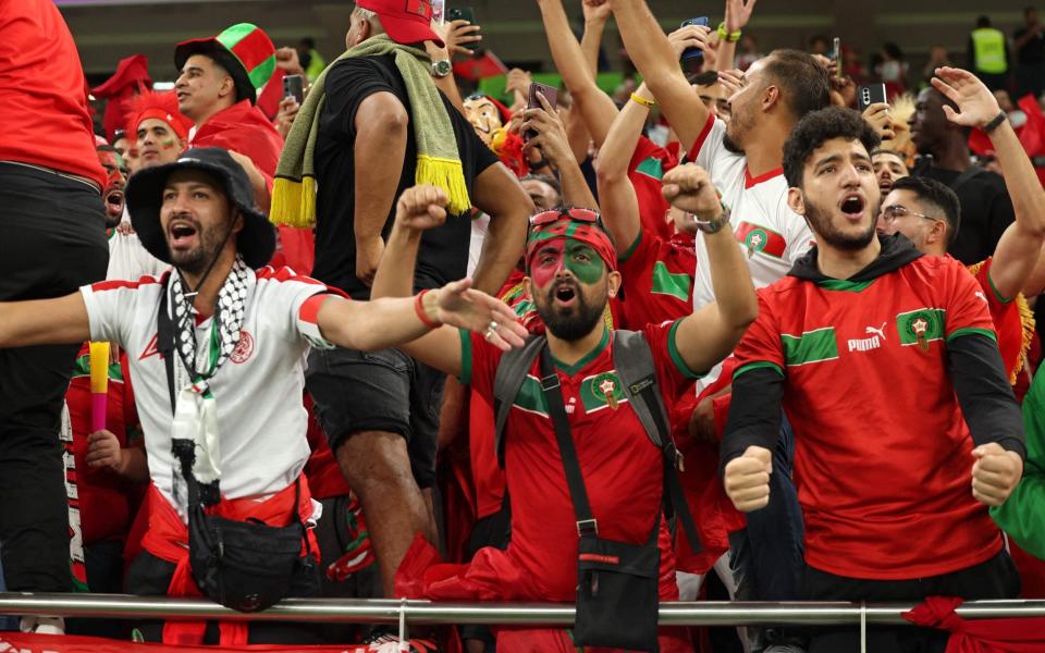 Morocco fans wait for the start of the Qatar 2022 World Cup Group F football match between Canada and Morocco at the Al-Thumama Stadium in Doha - Fadel Senna/Getty Images