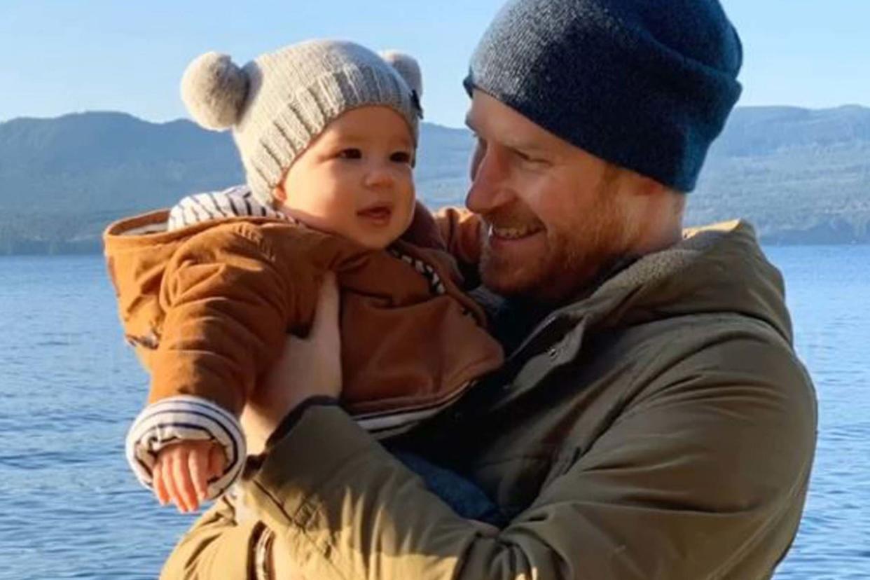 Prince Harry cuddles baby Archie during the family's Christmas break: PA