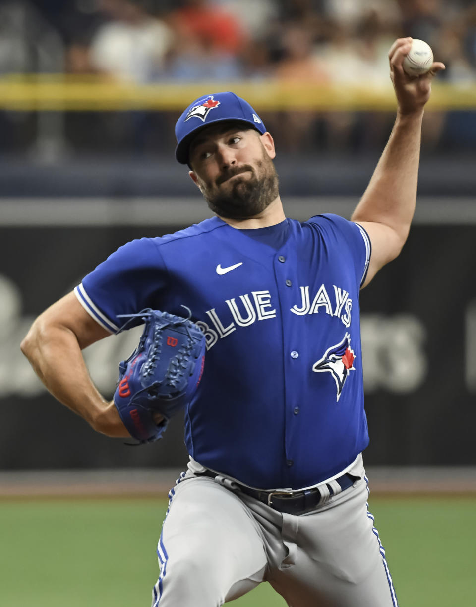 Toronto Blue Jays starter Robbie Ray pitches against the Tampa Bay Rays during the first inning of a baseball game Sunday, July 11, 2021, in St. Petersburg, Fla.(AP Photo/Steve Nesius)