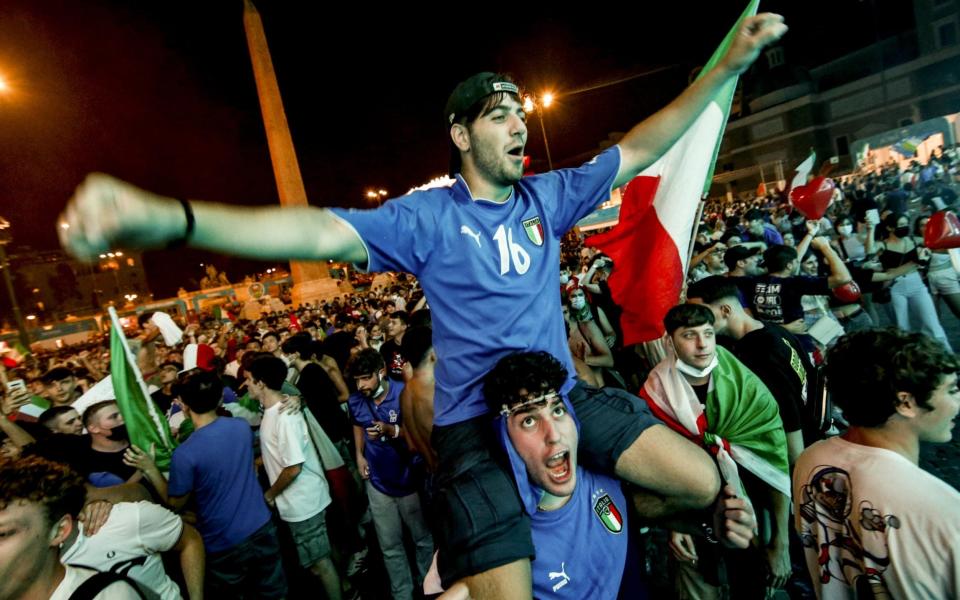 Italy fans celebrate their side reaching the quarter-finals - SHUTTERSTOCK