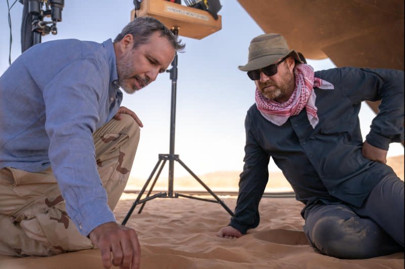 Denis Villeneuve (L) works with production designer Patrice Vermette. Photo courtesy of Warner Bros. Entertainment Inc.