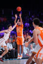 In a photo provided by Bahamas Visual Services, Tennessee's Santiago Vescovi (25) shoots over Southern California's Drew Peterson (13) during an NCAA college basketball game in the Battle 4 Atlantis at Paradise Island, Bahamas, Thursday, Nov. 24, 2022. (Tim Aylen/Bahamas Visual Services via AP)