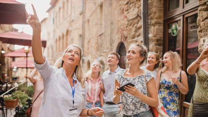 Medium group of people standing in a street in Volterra.