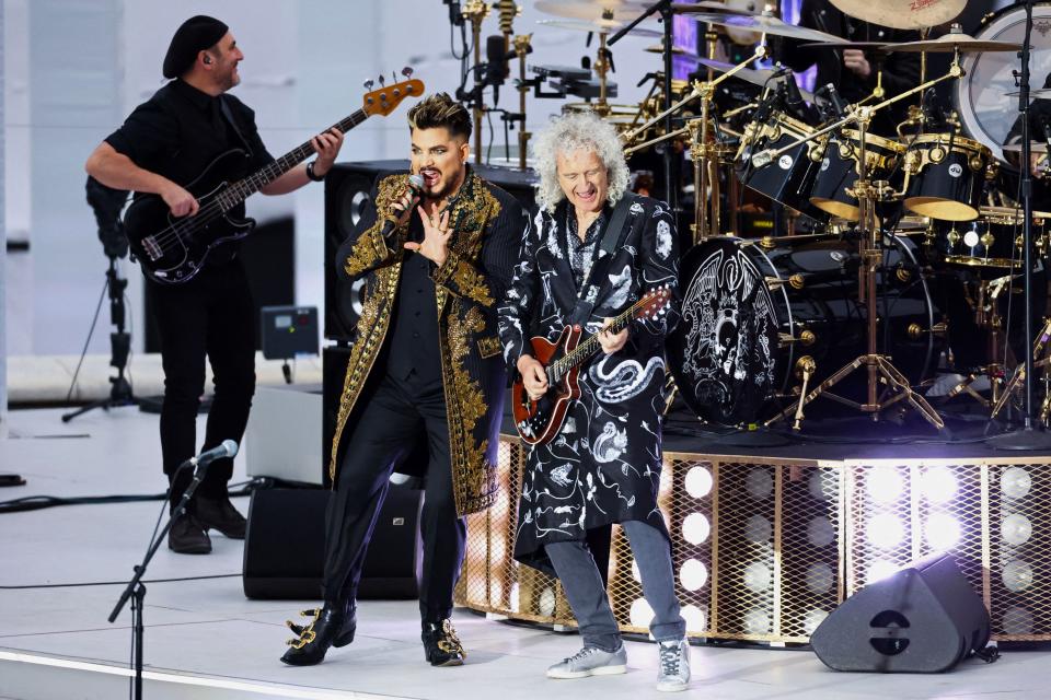 US singer and songwriter Adam Lambert (centre left) and British guitarist Brian May of Queen perform during the Platinum Party at Buckingham Palace on June 4, 2022 as part of Queen Elizabeth II's platinum jubilee celebrations.