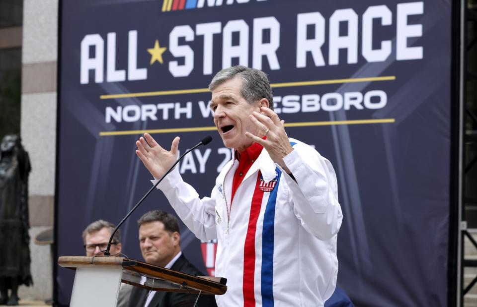 North Carolina Governor Roy Cooper speaks during a press conference announcing that the NASCAR All-Star Race will be held at North Wilkesboro Speedway in May 2023, on the steps of the N.C. Museum of History in Raleigh, N.C., Thursday, Sept. 8, 2022. (Ethan Hyman/The News & Observer via AP)