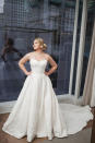 <p>Lawrence wears a classic strapless lace wedding dress by Justin Alexander. (Photo: courtesy of Justin Alexander) </p>