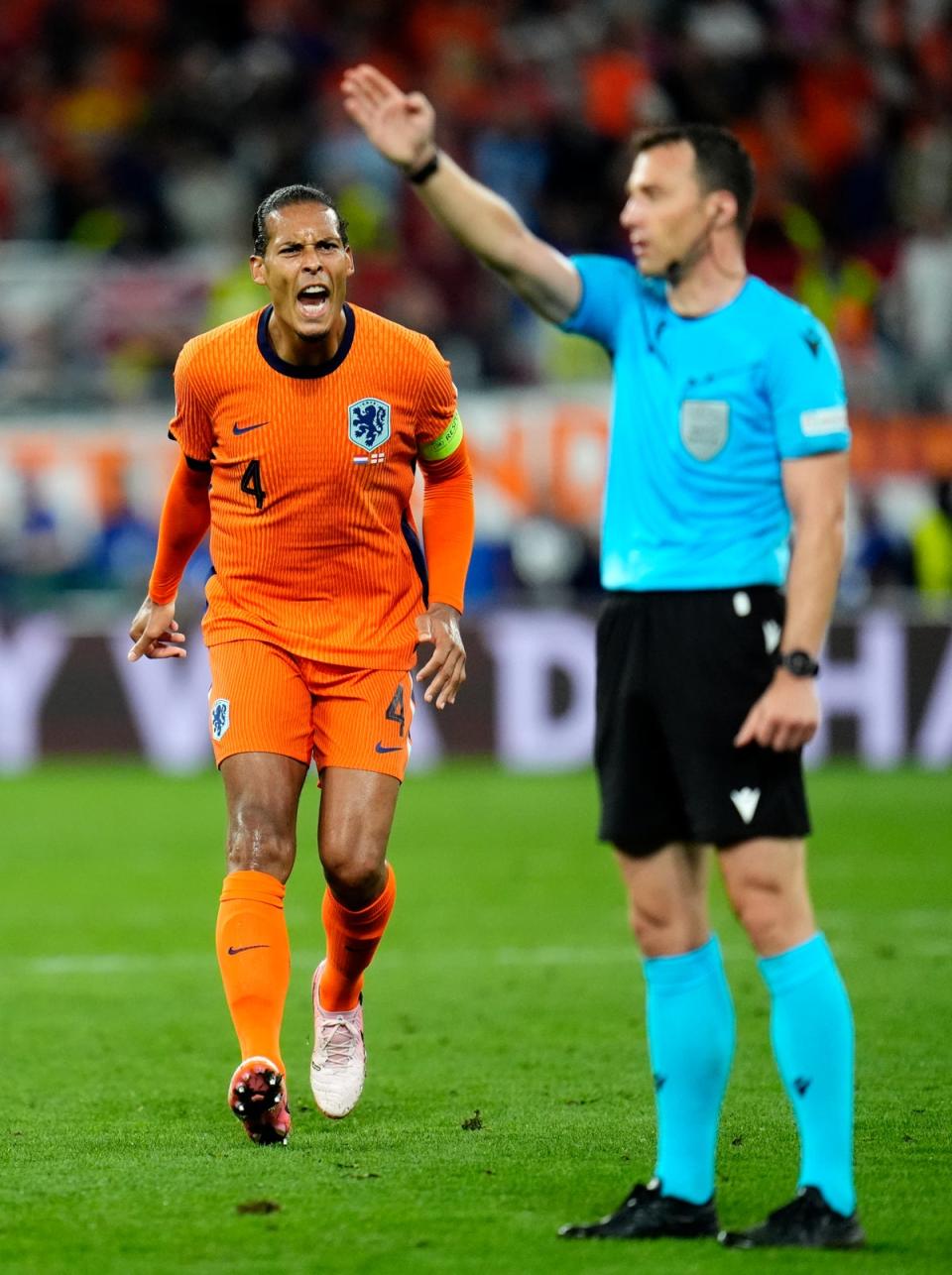 Virgil van Dijk of the Netherlands appeals to referee Felix Zwayer (Nick Potts/PA Wire)