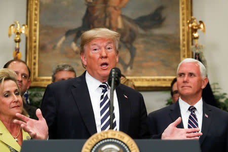 U.S. President Donald Trump gestures as he speaks before the signing ceremony for S. 2155 - Economic Growth, Regulatory Relief, and Consumer Protection Act in the Roosevelt Room at the White House in Washington, U.S., May 24, 2018. REUTERS/Kevin Lamarque