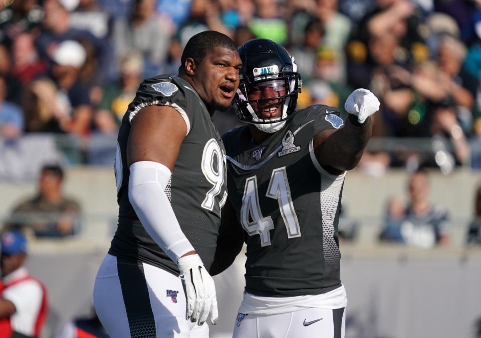 Jan 26, 2020; Orlando, Florida, USA; AFC defensive end Calais Campbell of the Jacksonville Jaguars and defensive end Josh Allen of the Jacksonville Jaguars (41) react in the second quarter against the NFC in the 2020 NFL Pro Bowl at Camping World Stadium. The AFC defeated the NFC 38-33. Mandatory Credit: Kirby Lee-USA TODAY Sports