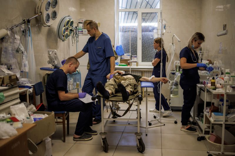 Doctors treat wounded soldiers at a frontline military hospital in Donetsk region, as Russia's attack on Ukraine continues