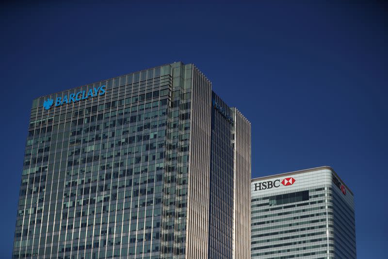 HSBC and Barclays' buildings in Canary Wharf are seen on a clear morning in London