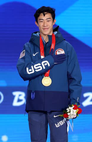<p>Jean Catuffe/Getty</p> Gold medallist Nathan Chen of Team United States celebrates during the 2022 Winter Olympics Games in Beijing