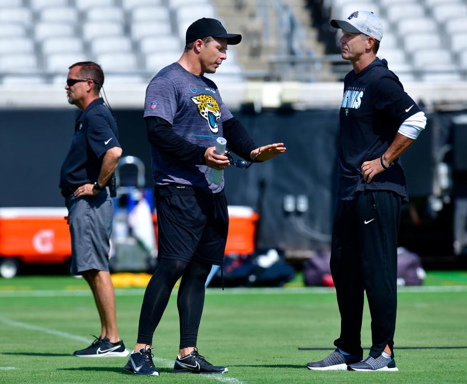 Jaguars special teams coordinator Heath Farwell talks with general manager Trent Baalke during the Jaguars minicamp session at TIAA Bank Field in Jacksonville, FL Wednesday, June 15, 2022.