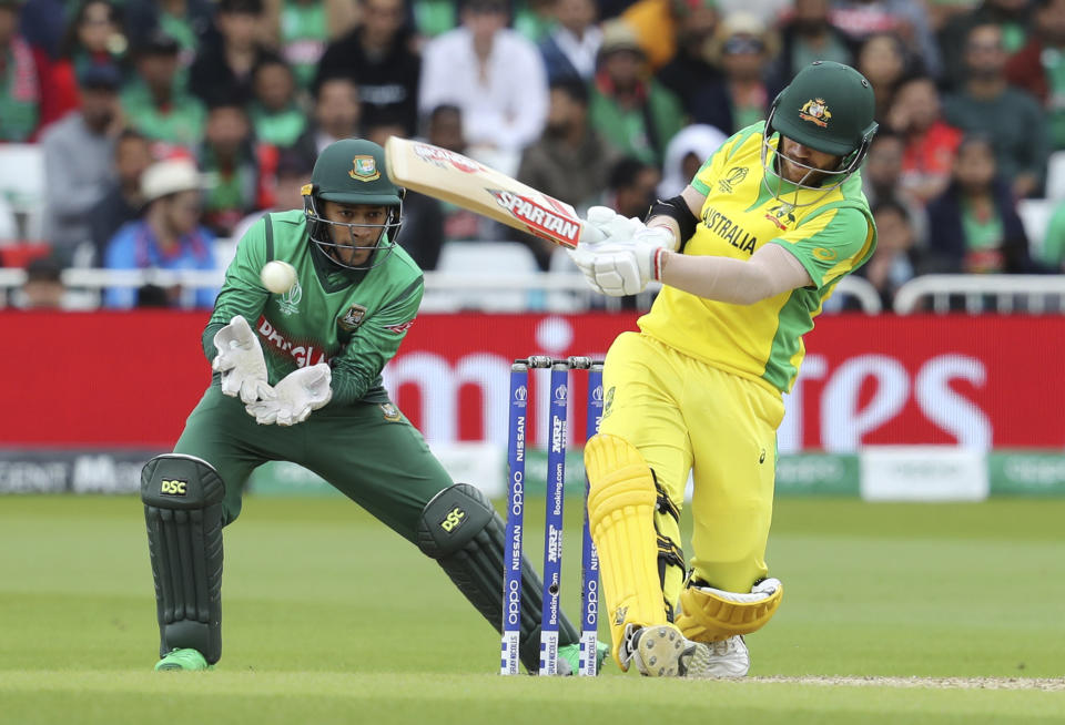 Australia's David Warner, right, bats during the Cricket World Cup match between Australia and Bangladesh at Trent Bridge in Nottingham, Thursday, June 20, 2019. (AP Photo/Rui Vieira)