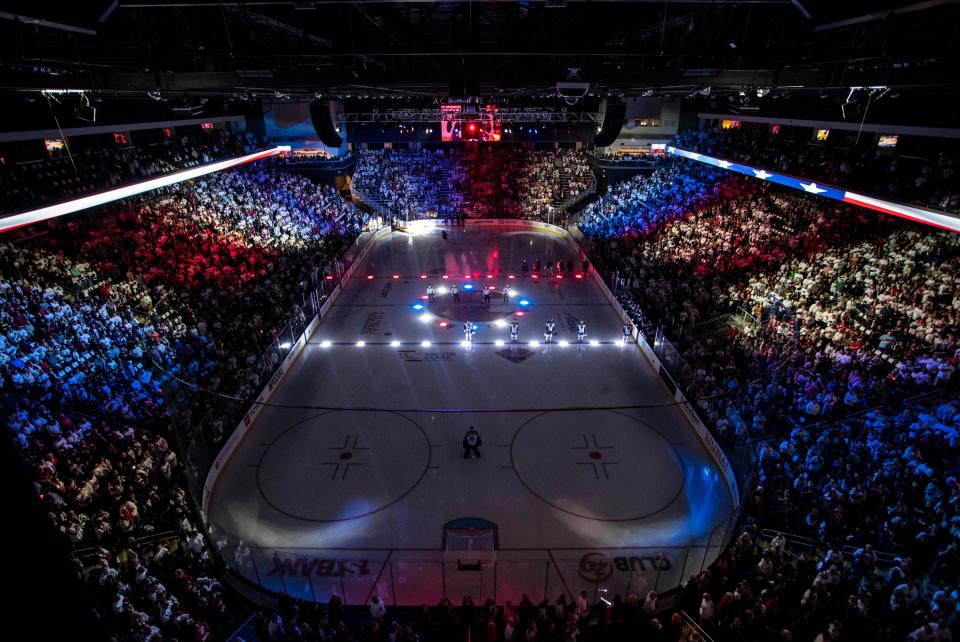 Coachella Valley Firebirds and Milwaukee Admirals players stand for the national anthem before game two of the Western Conference Finals at Acrisure Arena in Palm Desert, Calif., Saturday, May 27, 2023. 