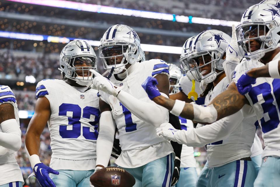 Dallas Cowboys safety Jayron Kearse (1) celebrates making an interception along with his teammates in the fourth quarter against the New York Jets at AT&T Stadium.