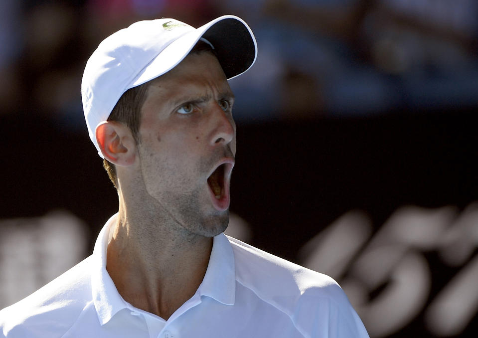 Serbia's Novak Djokovic reacts after winning the second set against Canada's Denis Shapovalov during their third round match at the Australian Open tennis championships in Melbourne, Australia, Saturday, Jan. 19, 2019. (AP Photo/Andy Brownbill)