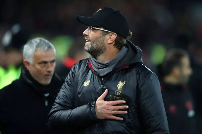 Jürgen Klopp, Manager of Liverpool and José Mourinho, Manager of Manchester United looks on prior to the Premier League match between Liverpool FC and Manchester United at Anfield on December 16, 2018 in Liverpool, United Kingdom.