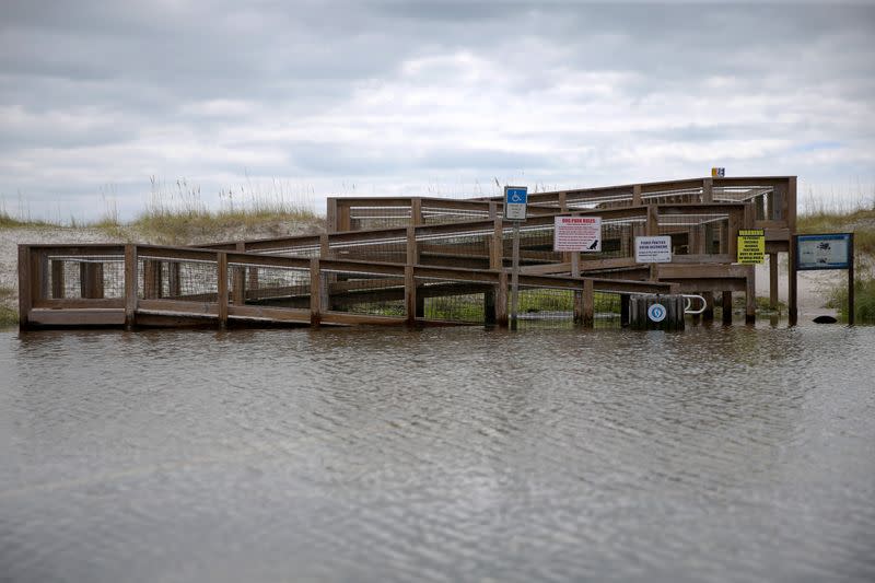 A flooded entrance to a pier is pictured after Hurricane Sally in Pensacola Beach, Florida