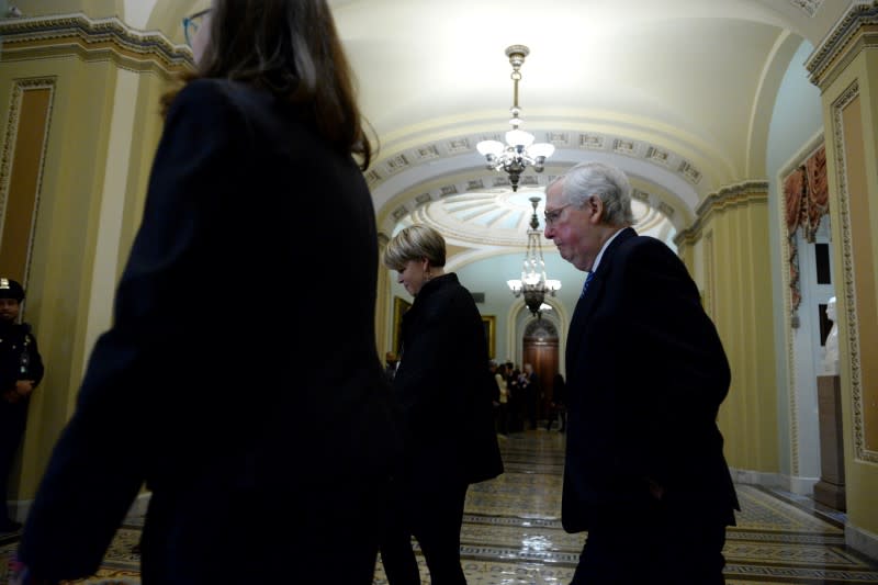 "Senator Majority Leader" Mitch McConnell, R-KY, heads to Senate Chambers after a dinner recess of the Senate impeachment trial of President Donald Trump