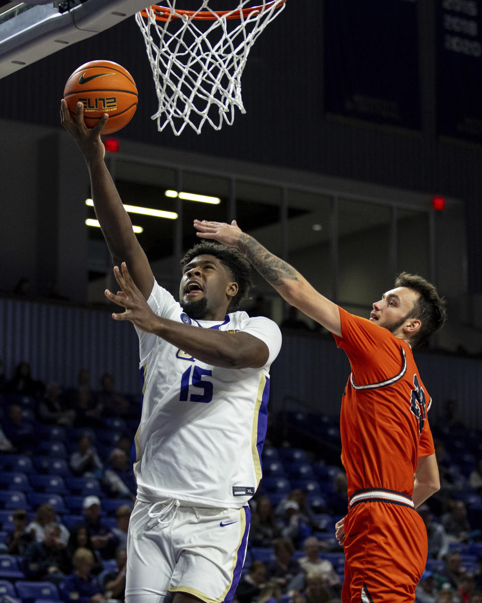 James Madison forward Jaylen Carey (15) takes a shot against Keystone center Redio Risell (25) during the second half of an NCAA college basketball game in Harrisonburg, Va., Sunday, Dec. 3, 2023. (Daniel Lin/Daily News-Record via AP)